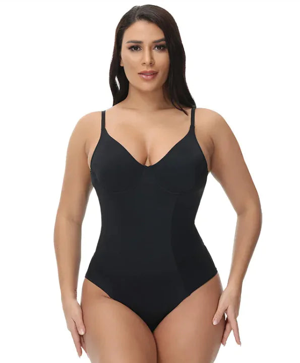 Woman wearing a black bodysuit on a white background